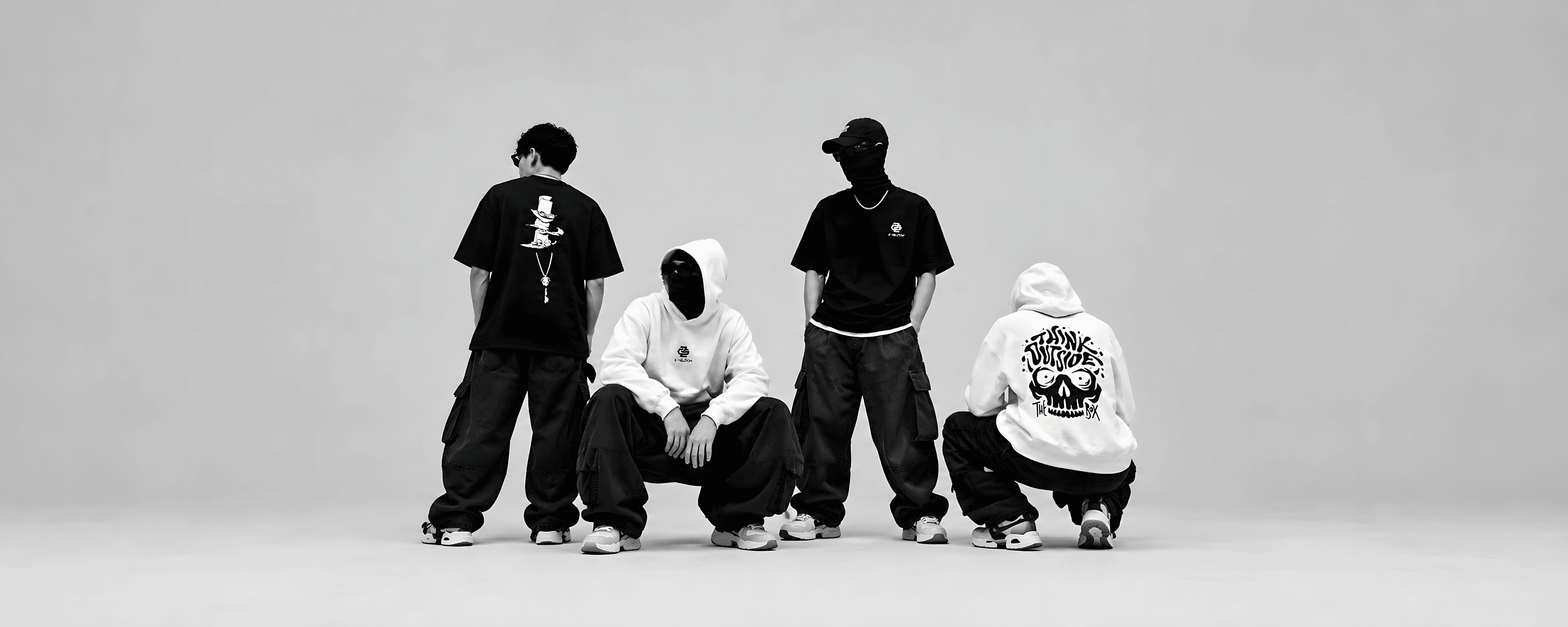 Z-GLITCH crew in black and white hoodies and tees